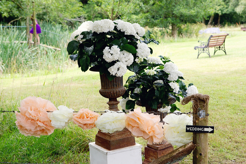 A Claire Pettibone dress for a British and French Summer garden party wedding. Photography by Lydia Stamps.