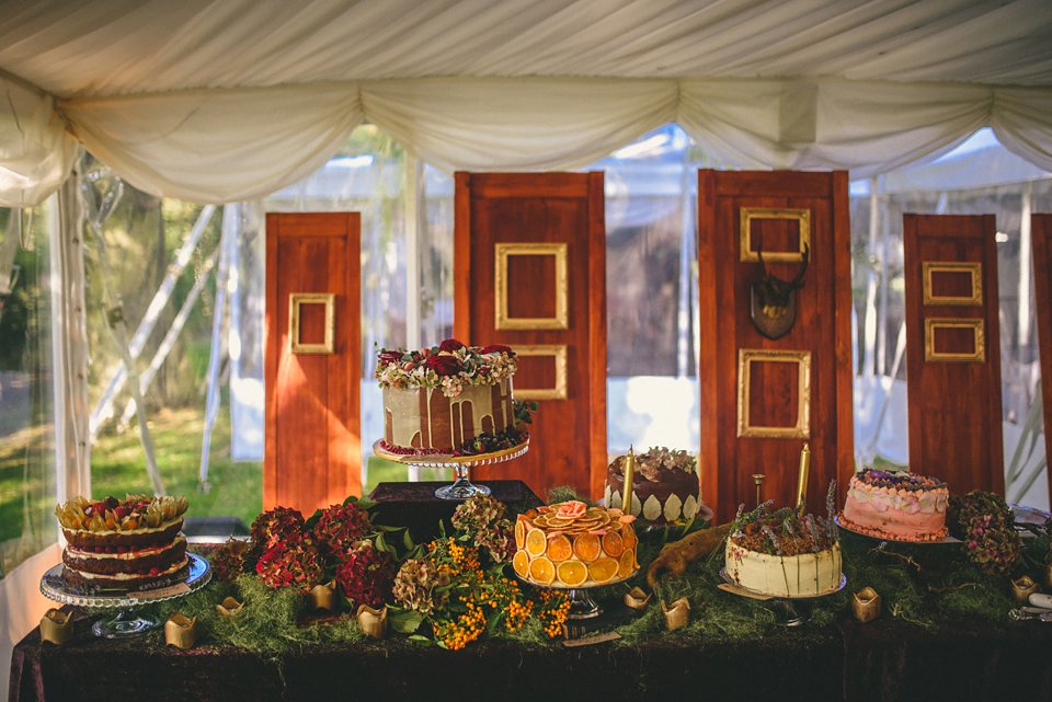 Bold colour and angel wings for a dramatic vintage drama meets whimsical elegance wedding. Images by Miki Photography.