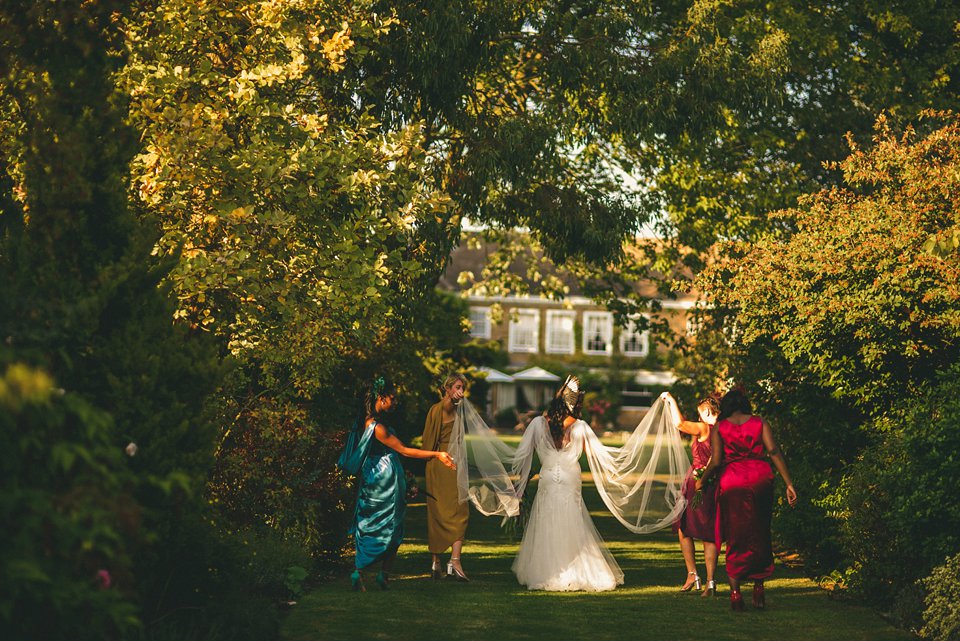 Bold colour and angel wings for a dramatic vintage drama meets whimsical elegance wedding. Images by Miki Photography.