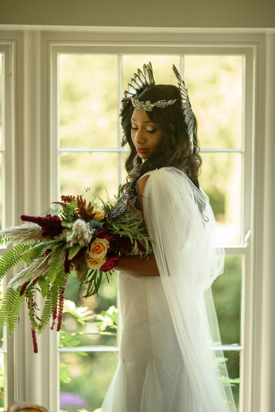 Bold colour and angel wings for a dramatic vintage drama meets whimsical elegance wedding. Images by Miki Photography.