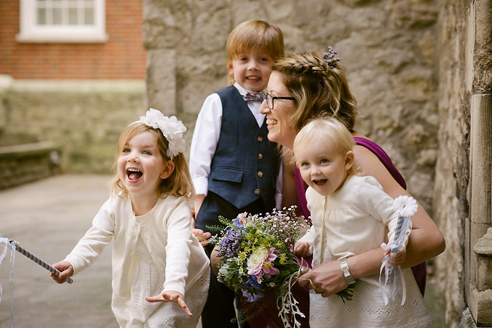 A sweet Dessy bride and her maids in pretty purple for a floral wedding in London. Lily Sawyer Photography.