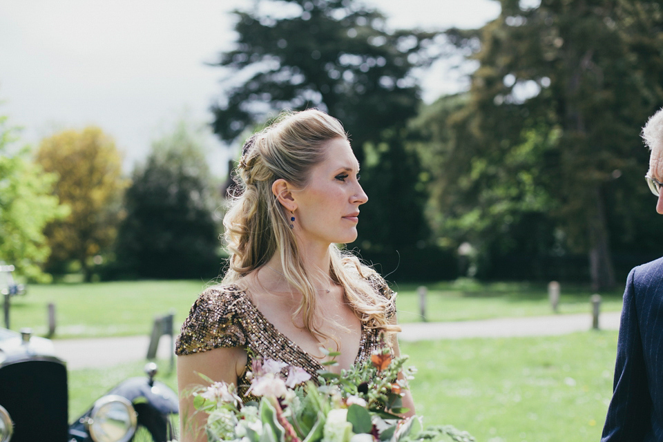 Rah wore a gold sequin wedding dress for her Suffolk barn wedding with a twist. Photography by Emily Brittain.