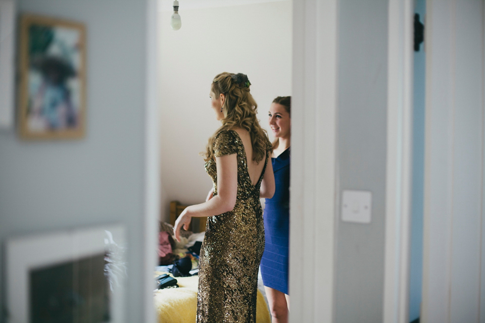 Rah wore a gold sequin wedding dress for her Suffolk barn wedding with a twist. Photography by Emily Brittain.