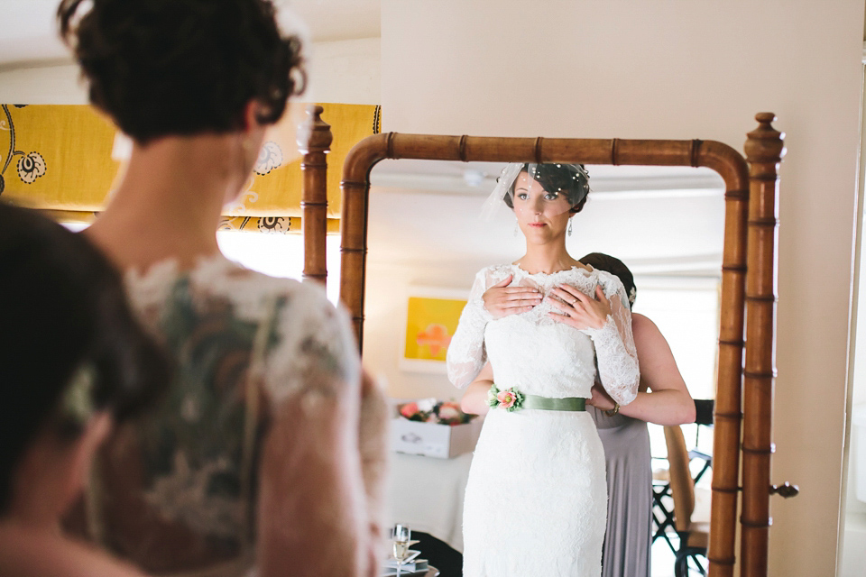 Becki wears an Ivy and Aster gown and Emmy London shoes and a draped art-deco inspired headpiece for her vintage inspried wedding at the George in Rye. Photography by Parkershots.