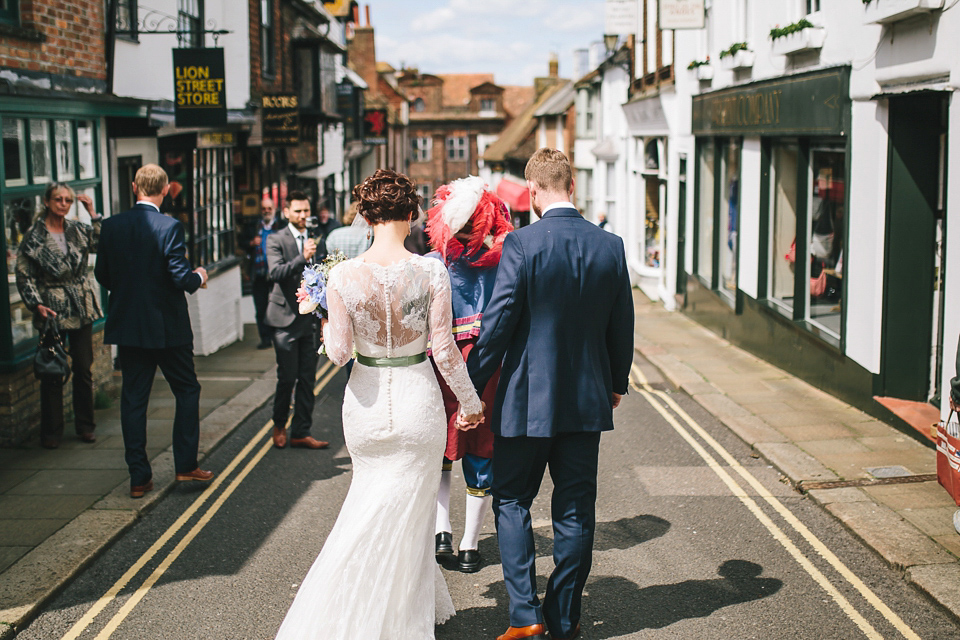 Becki wears an Ivy and Aster gown and Emmy London shoes and a draped art-deco inspired headpiece for her vintage inspried wedding at the George in Rye. Photography by Parkershots.