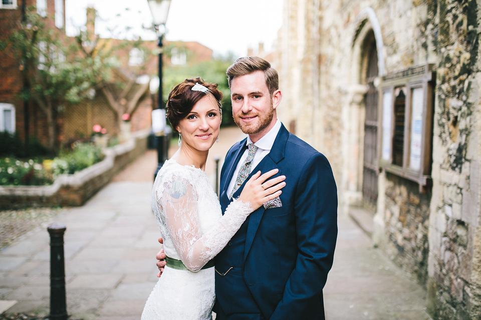 Becki wears an Ivy and Aster gown and Emmy London shoes and a draped art-deco inspired headpiece for her vintage inspried wedding at the George in Rye. Photography by Parkershots.