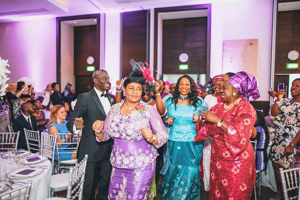 An Essense of Australia gown for a Caribbean Nigerial fusion wedding in London. Photography by Nicholas Lau.