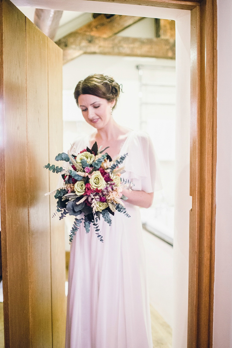 Rebeca wore a Jenny Packham gown for her homemade, Autumn wedding in the Lake District. Photography by Jessica Reeve.