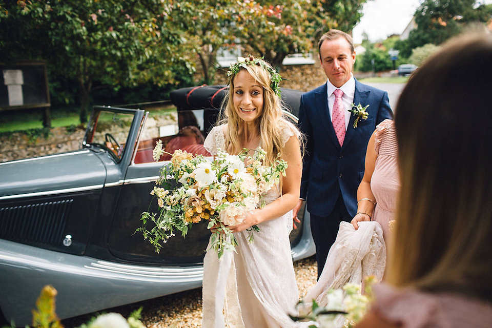 Bride Hannah wore a delicate lace gown by designer Jane Bourvis for her rustic and whimsical woodland wedding. Photography by Red on Blonde.