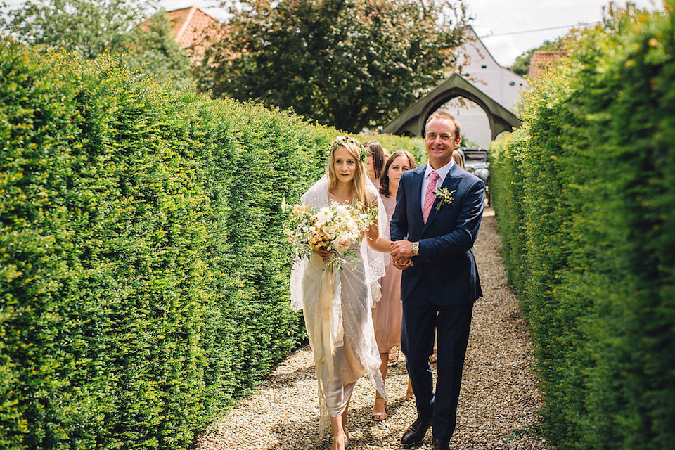 Bride Hannah wore a delicate lace gown by designer Jane Bourvis for her rustic and whimsical woodland wedding. Photography by Red on Blonde.