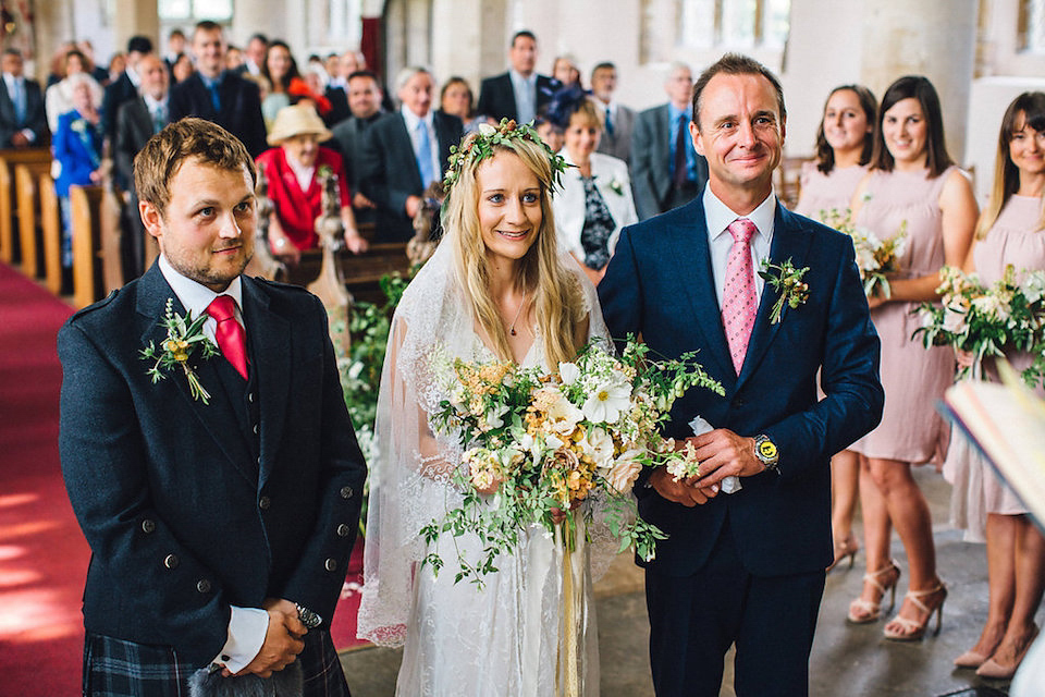 Bride Hannah wore a delicate lace gown by designer Jane Bourvis for her rustic and whimsical woodland wedding. Photography by Red on Blonde.