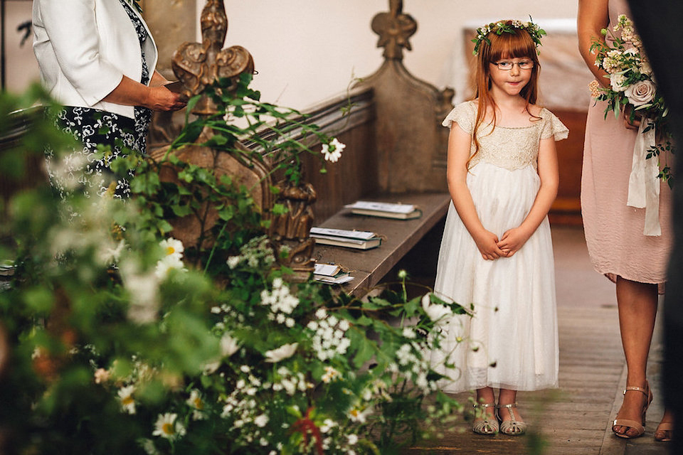 Bride Hannah wore a delicate lace gown by designer Jane Bourvis for her rustic and whimsical woodland wedding. Photography by Red on Blonde.