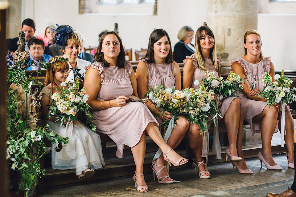 Bride Hannah wore a delicate lace gown by designer Jane Bourvis for her rustic and whimsical woodland wedding. Photography by Red on Blonde.