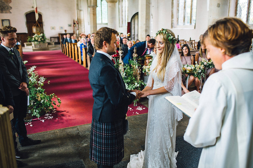 Bride Hannah wore a delicate lace gown by designer Jane Bourvis for her rustic and whimsical woodland wedding. Photography by Red on Blonde.