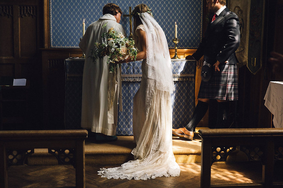 Bride Hannah wore a delicate lace gown by designer Jane Bourvis for her rustic and whimsical woodland wedding. Photography by Red on Blonde.