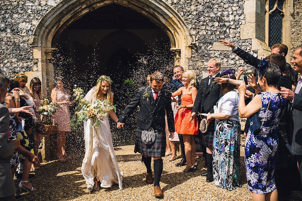 Bride Hannah wore a delicate lace gown by designer Jane Bourvis for her rustic and whimsical woodland wedding. Photography by Red on Blonde.