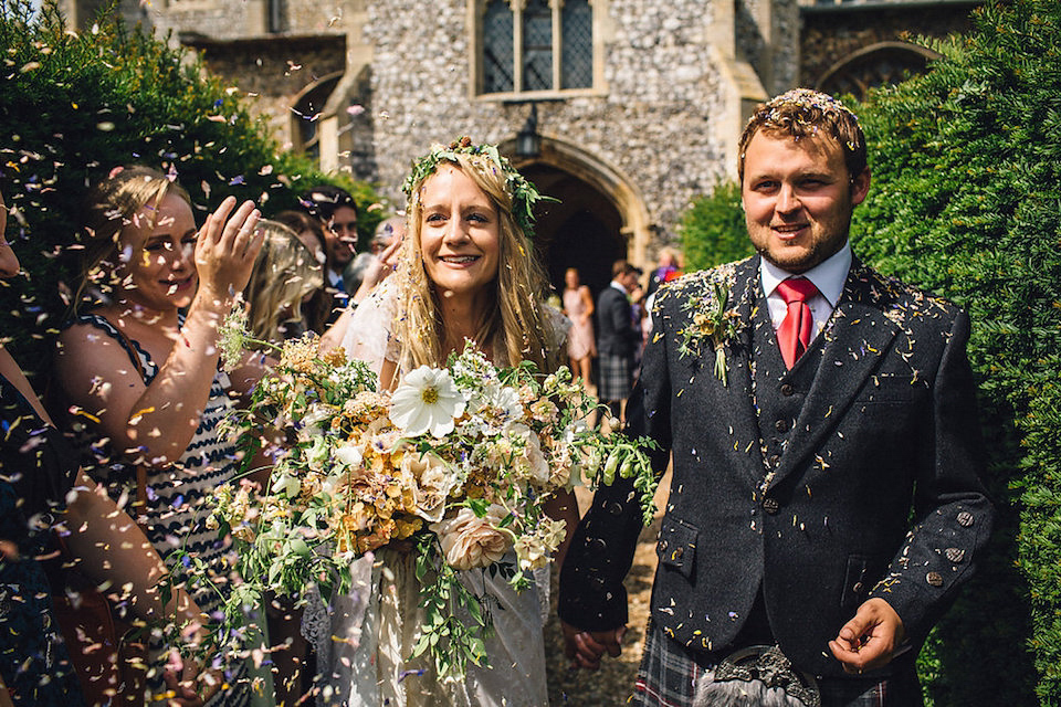 Bride Hannah wore a delicate lace gown by designer Jane Bourvis for her rustic and whimsical woodland wedding. Photography by Red on Blonde.