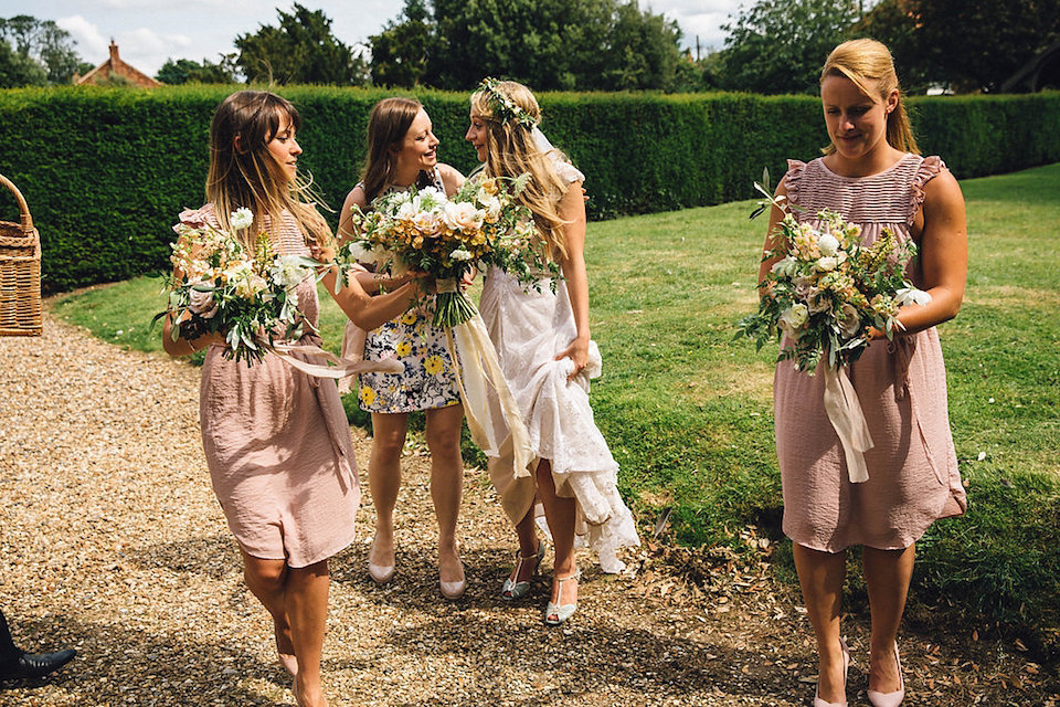 Bride Hannah wore a delicate lace gown by designer Jane Bourvis for her rustic and whimsical woodland wedding. Photography by Red on Blonde.