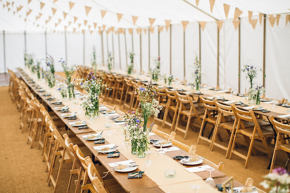 Bride Hannah wore a delicate lace gown by designer Jane Bourvis for her rustic and whimsical woodland wedding. Photography by Red on Blonde.