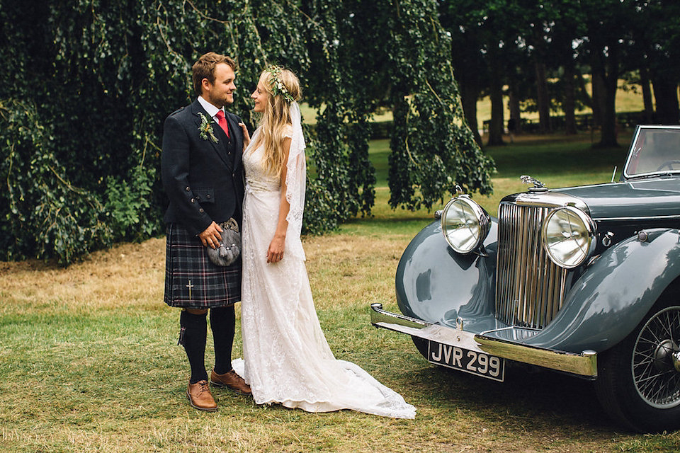 Bride Hannah wore a delicate lace gown by designer Jane Bourvis for her rustic and whimsical woodland wedding. Photography by Red on Blonde.