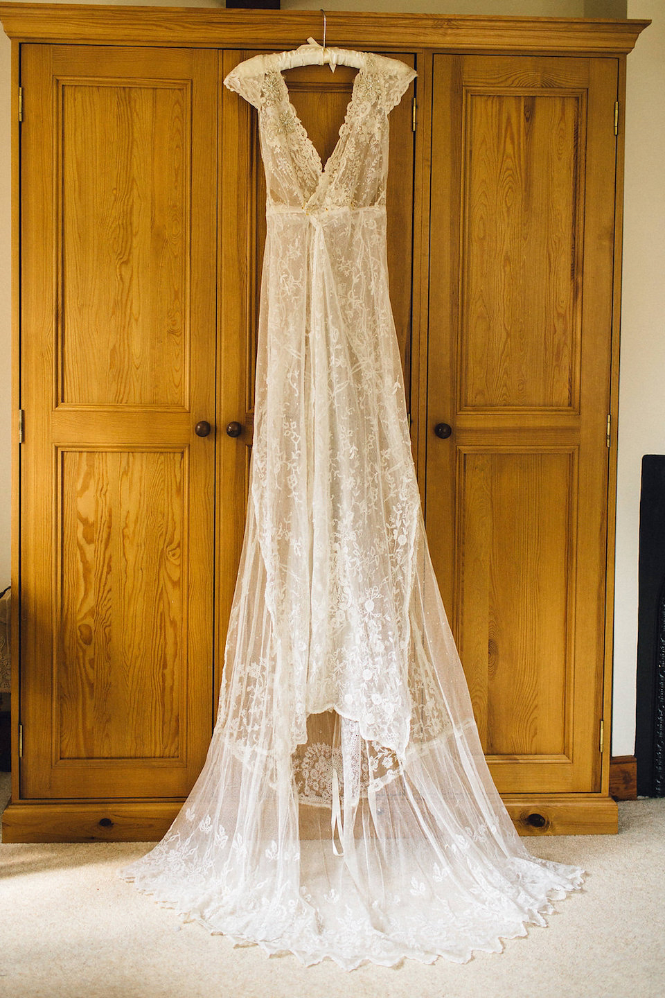 Bride Hannah wore a delicate lace gown by designer Jane Bourvis for her rustic and whimsical woodland wedding. Photography by Red on Blonde.