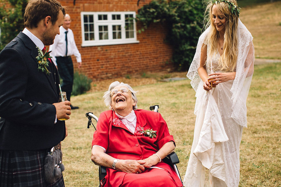 Bride Hannah wore a delicate lace gown by designer Jane Bourvis for her rustic and whimsical woodland wedding. Photography by Red on Blonde.