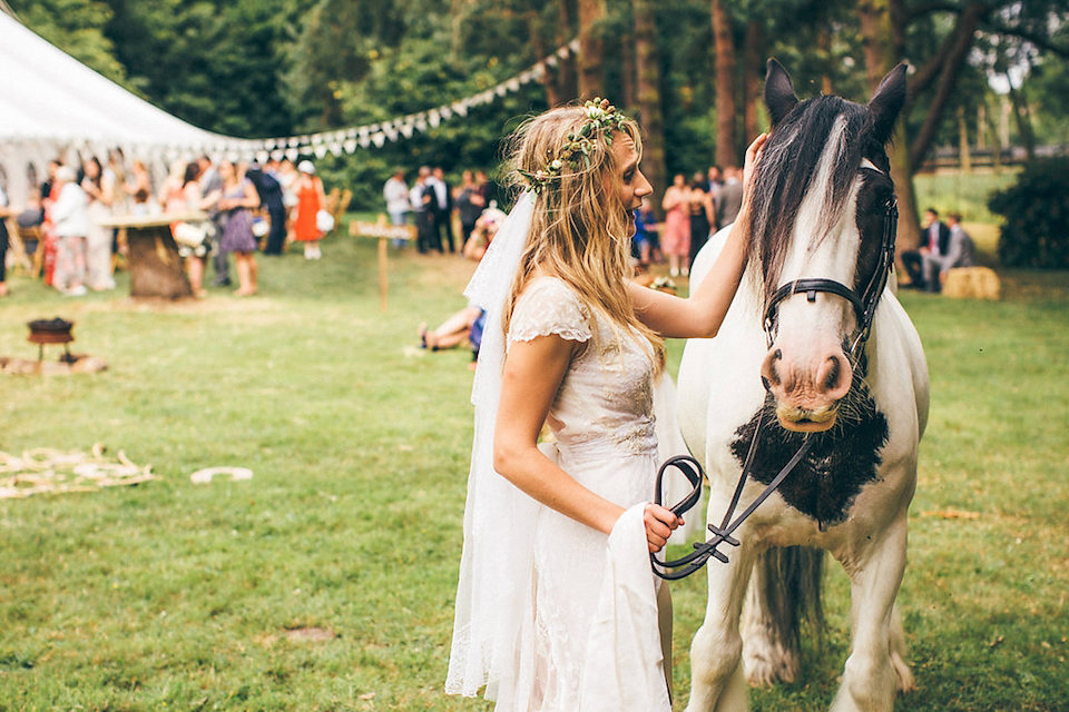 Bride Hannah wore a delicate lace gown by designer Jane Bourvis for her rustic and whimsical woodland wedding. Photography by Red on Blonde.