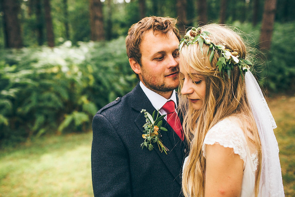 Bride Hannah wore a delicate lace gown by designer Jane Bourvis for her rustic and whimsical woodland wedding. Photography by Red on Blonde.