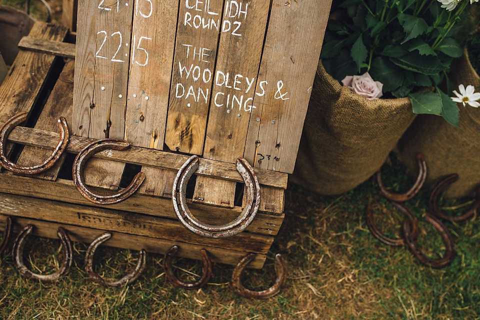 Bride Hannah wore a delicate lace gown by designer Jane Bourvis for her rustic and whimsical woodland wedding. Photography by Red on Blonde.