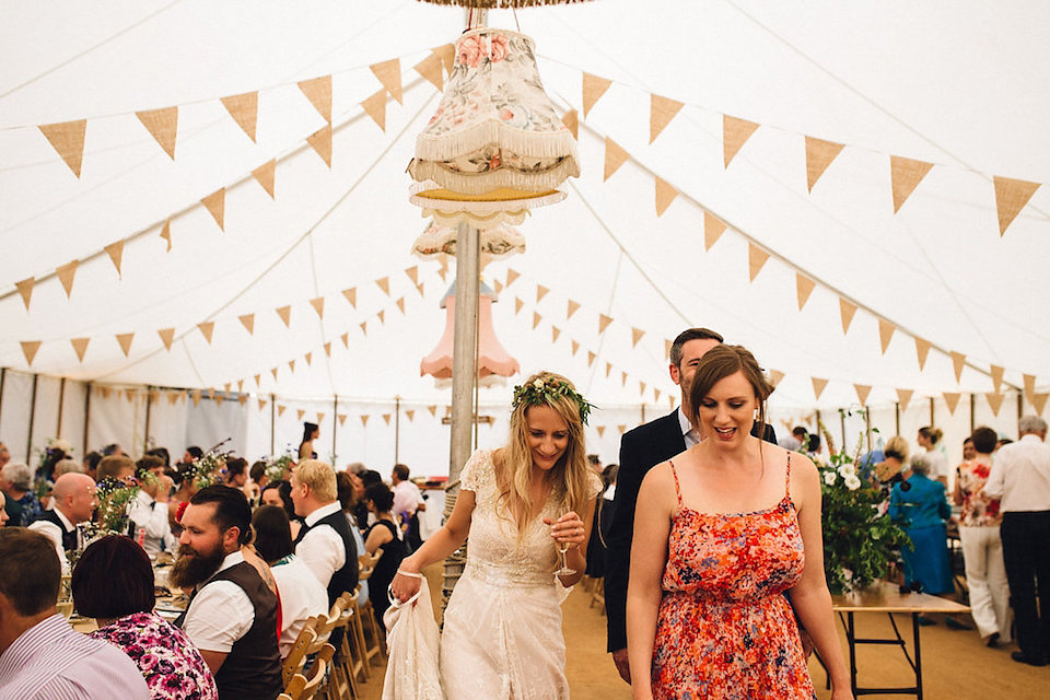 Bride Hannah wore a delicate lace gown by designer Jane Bourvis for her rustic and whimsical woodland wedding. Photography by Red on Blonde.