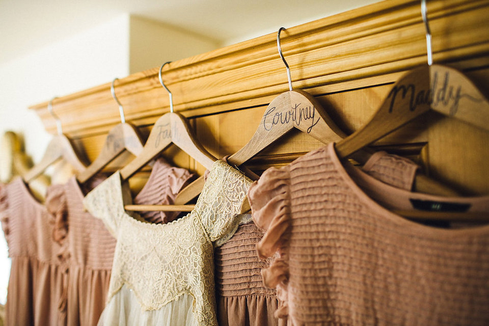 Bride Hannah wore a delicate lace gown by designer Jane Bourvis for her rustic and whimsical woodland wedding. Photography by Red on Blonde.