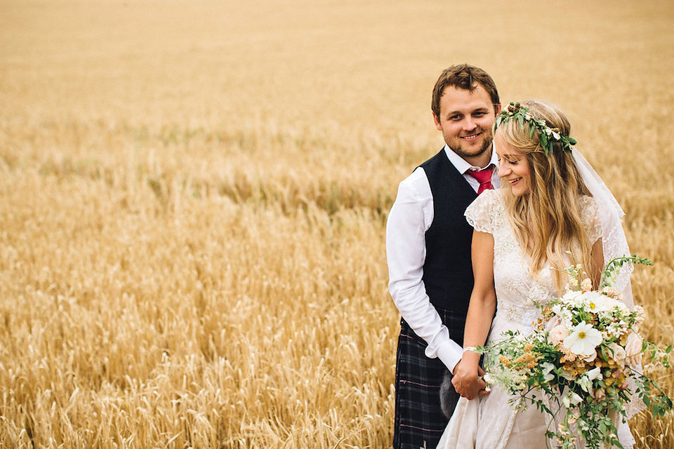 Bride Hannah wore a delicate lace gown by designer Jane Bourvis for her rustic and whimsical woodland wedding. Photography by Red on Blonde.