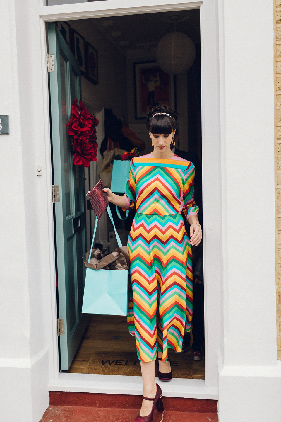 Megan wears a colourful rainbow Valentino gown for her cool and quirky London pub wedding. Photography by Lee Garland.