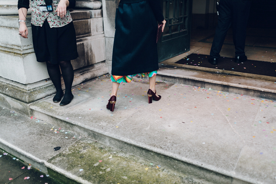 Megan wears a colourful rainbow Valentino gown for her cool and quirky London pub wedding. Photography by Lee Garland.