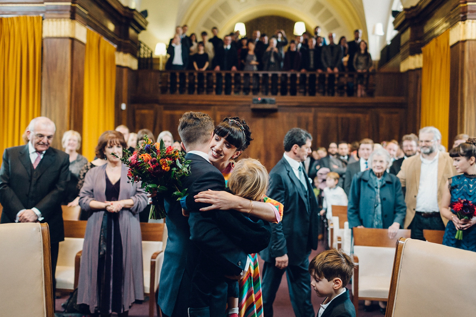 Megan wears a colourful rainbow Valentino gown for her cool and quirky London pub wedding. Photography by Lee Garland.