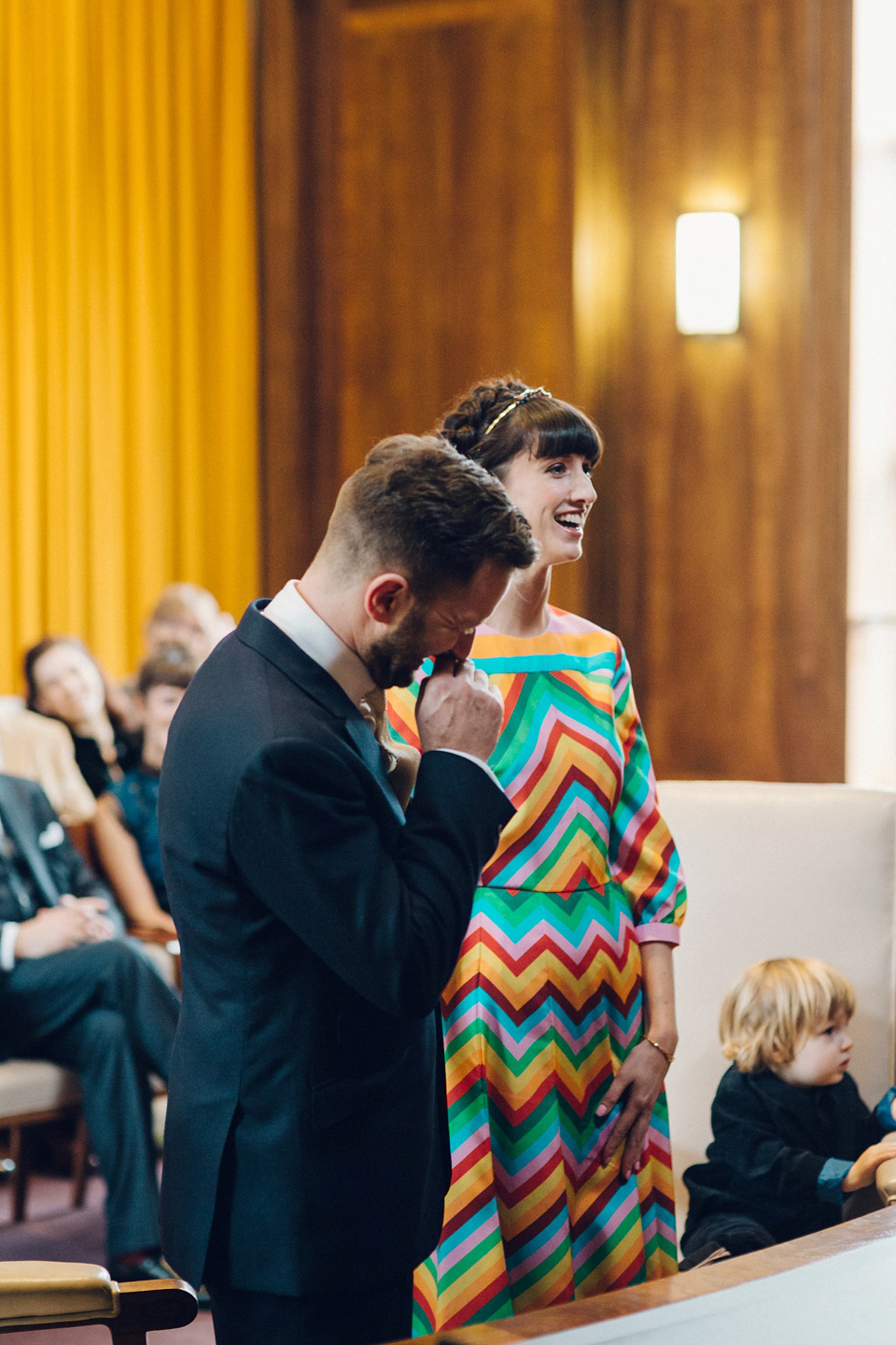 Megan wears a colourful rainbow Valentino gown for her cool and quirky London pub wedding. Photography by Lee Garland.