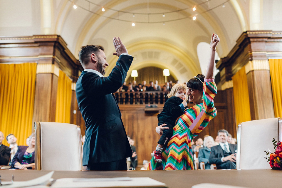 Megan wears a colourful rainbow Valentino gown for her cool and quirky London pub wedding. Photography by Lee Garland.