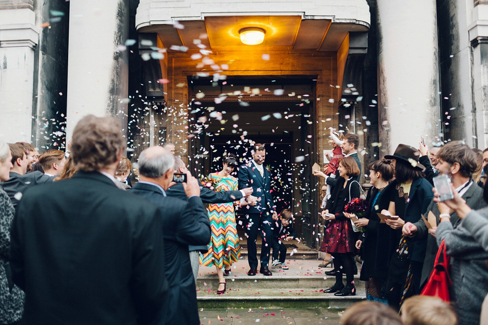 Megan wears a colourful rainbow Valentino gown for her cool and quirky London pub wedding. Photography by Lee Garland.