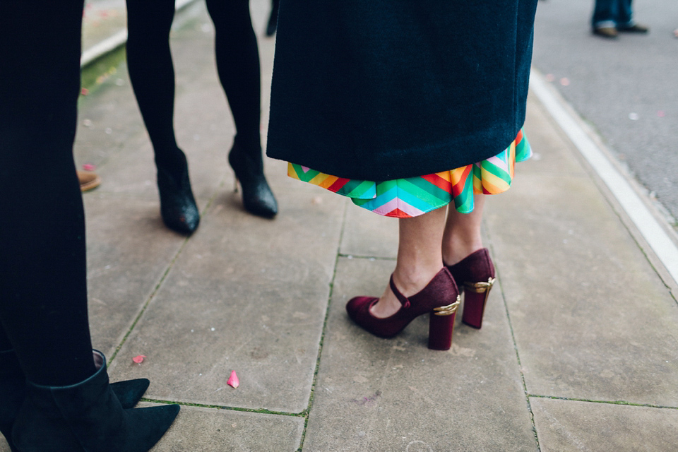 Megan wears a colourful rainbow Valentino gown for her cool and quirky London pub wedding. Photography by Lee Garland.