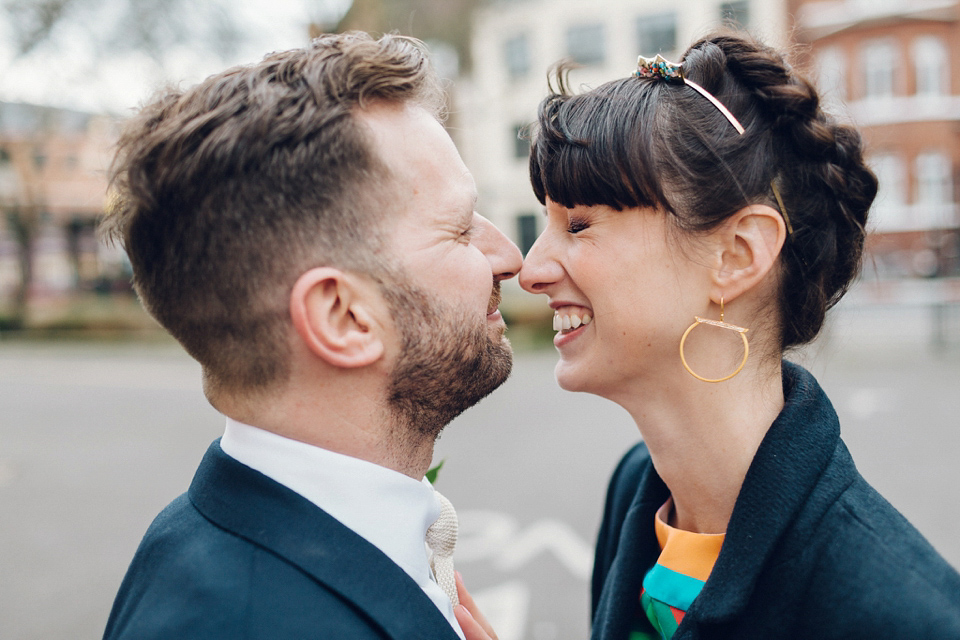 Megan wears a colourful rainbow Valentino gown for her cool and quirky London pub wedding. Photography by Lee Garland.