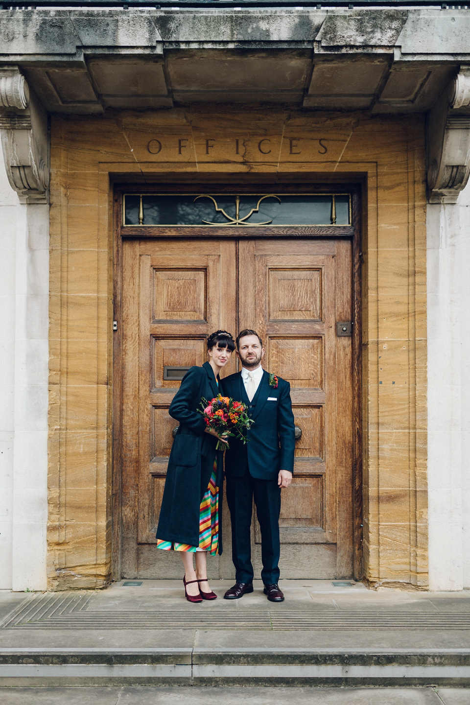 Megan wears a colourful rainbow Valentino gown for her cool and quirky London pub wedding. Photography by Lee Garland.