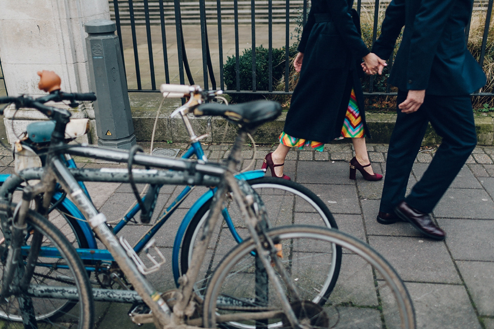 Megan wears a colourful rainbow Valentino gown for her cool and quirky London pub wedding. Photography by Lee Garland.