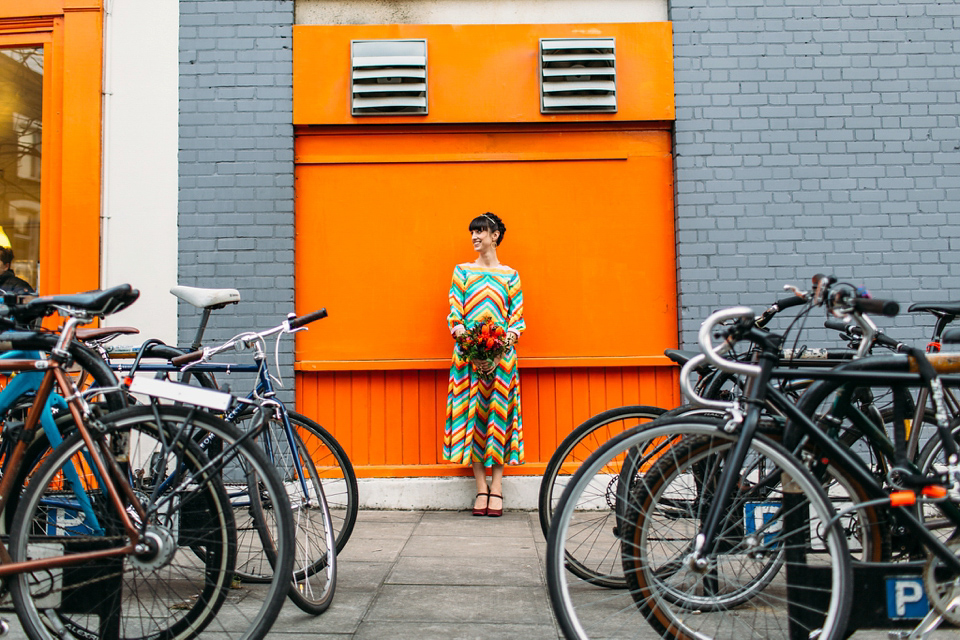 Megan wears a colourful rainbow Valentino gown for her cool and quirky London pub wedding. Photography by Lee Garland.