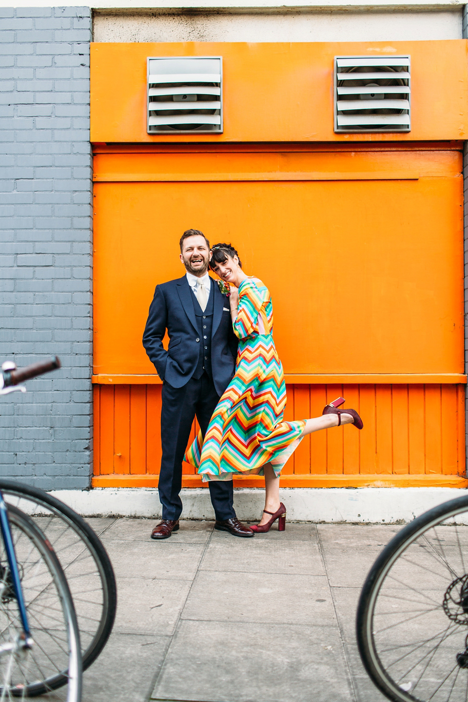 Megan wears a colourful rainbow Valentino gown for her cool and quirky London pub wedding. Photography by Lee Garland.