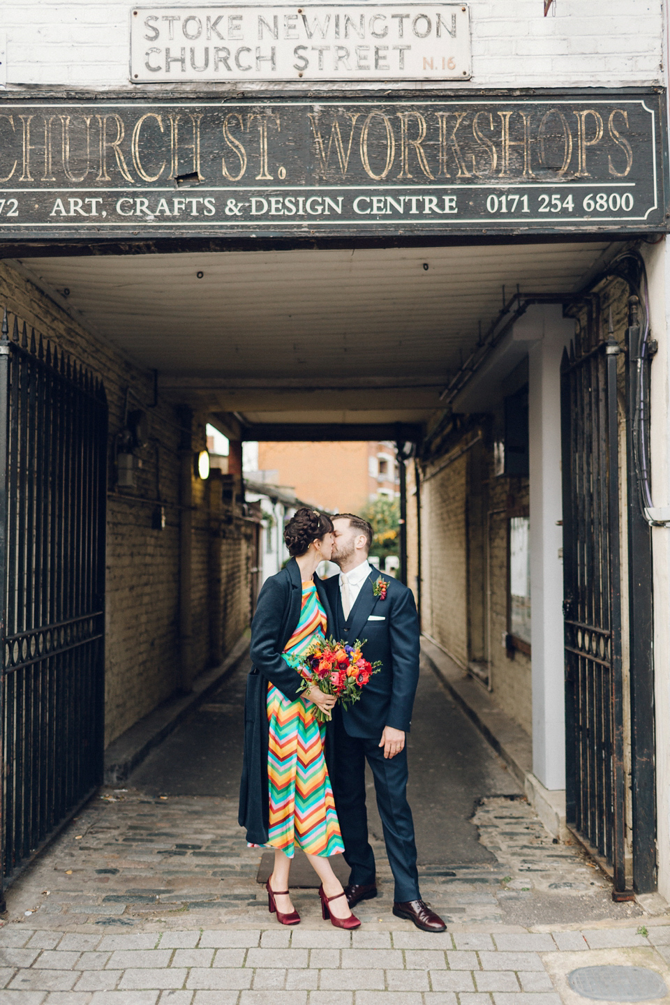 Megan wears a colourful rainbow Valentino gown for her cool and quirky London pub wedding. Photography by Lee Garland.