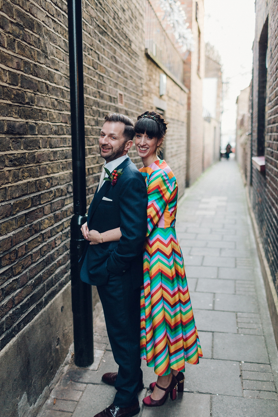 Megan wears a colourful rainbow Valentino gown for her cool and quirky London pub wedding. Photography by Lee Garland.