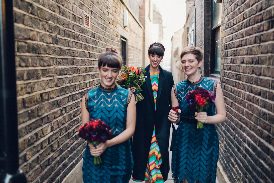 Megan wears a colourful rainbow Valentino gown for her cool and quirky London pub wedding. Photography by Lee Garland.