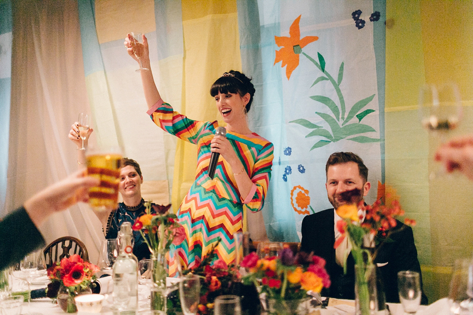 Megan wears a colourful rainbow Valentino gown for her cool and quirky London pub wedding. Photography by Lee Garland.