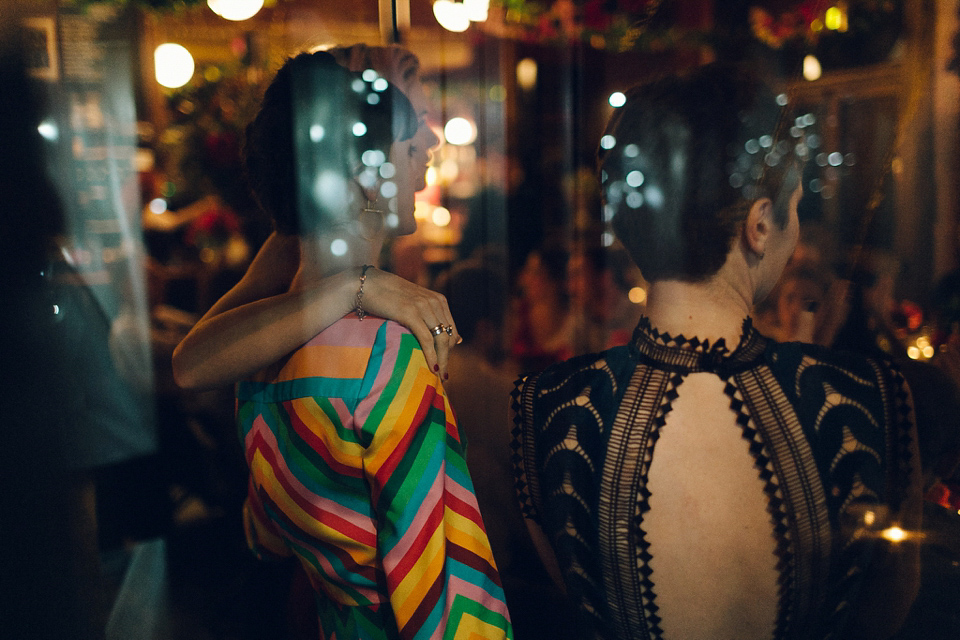 Megan wears a colourful rainbow Valentino gown for her cool and quirky London pub wedding. Photography by Lee Garland.