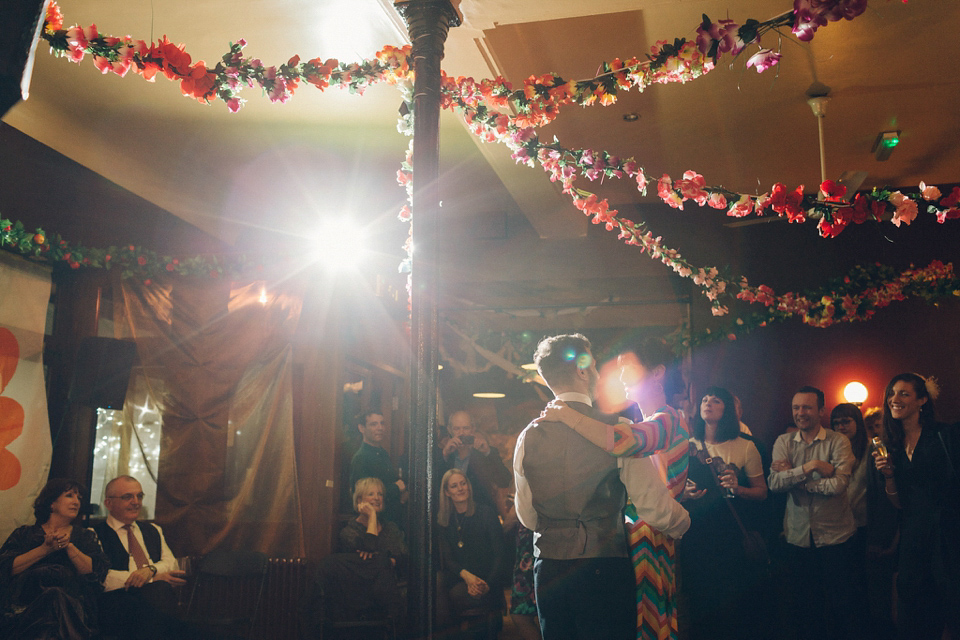 Megan wears a colourful rainbow Valentino gown for her cool and quirky London pub wedding. Photography by Lee Garland.